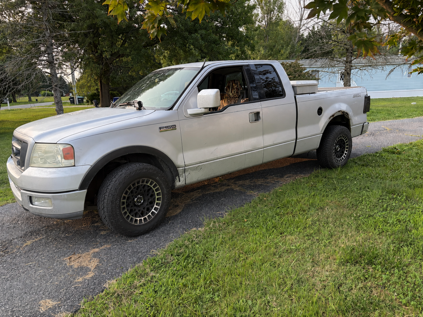 Morgan Mobile Mechanics silver Ford F-150 service truck parked in a driveway