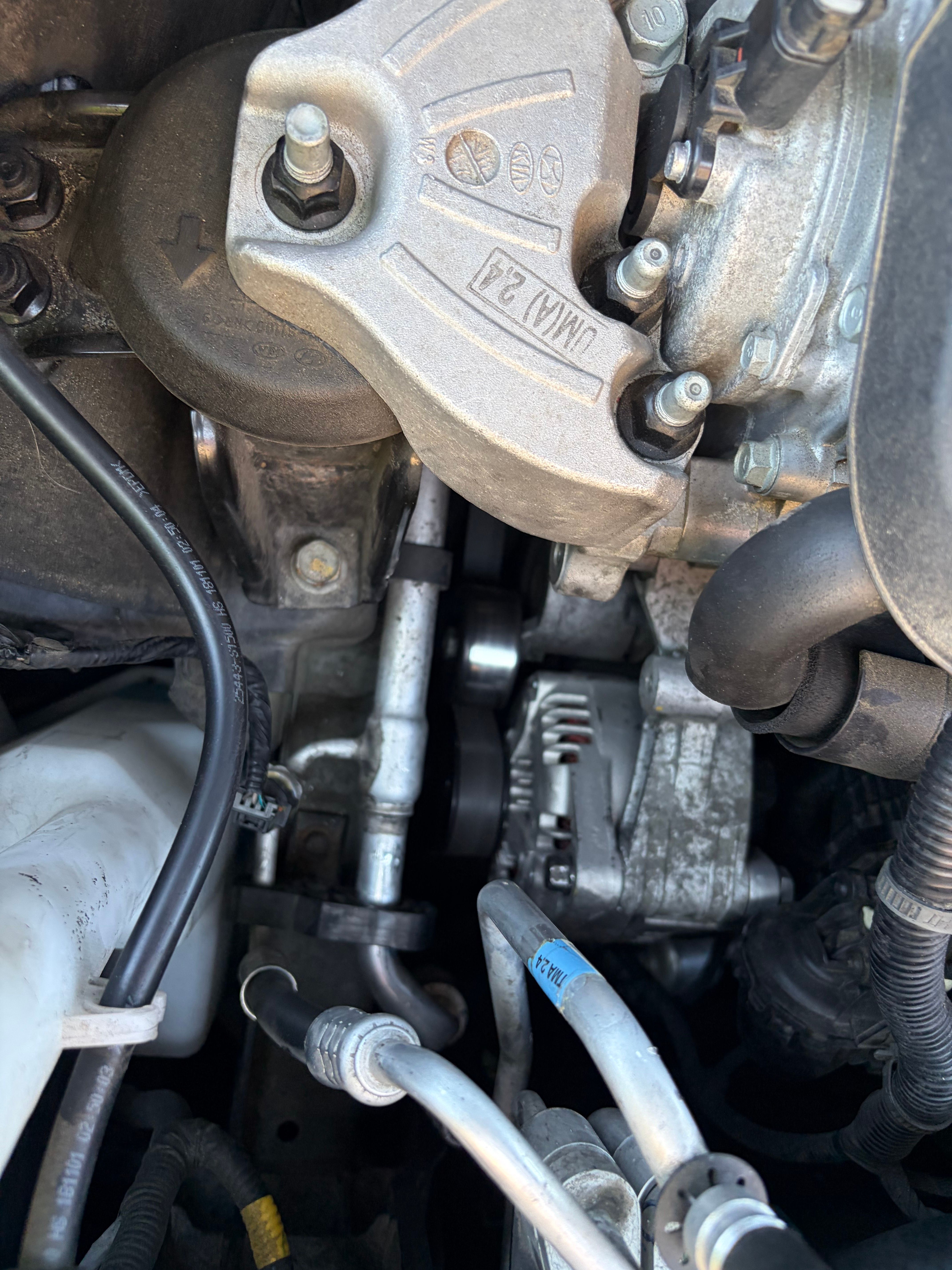 The replacement alternator installed and belt-driven in the engine bay.
